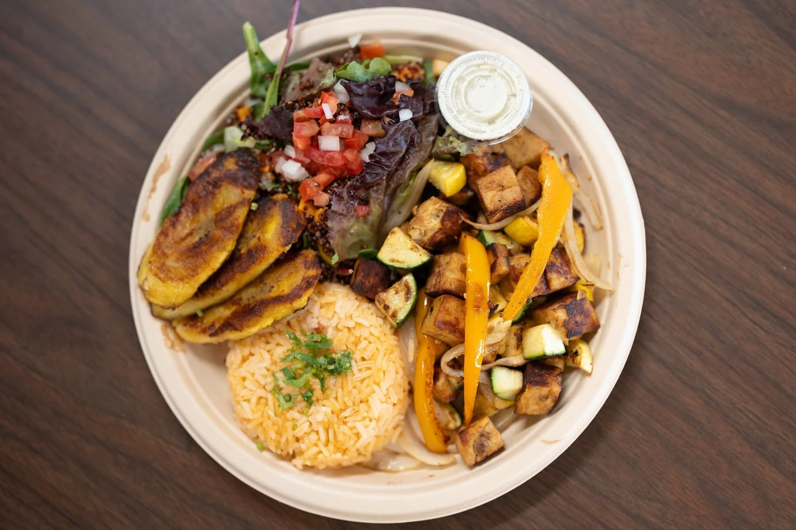 Veggie Plate with tofu fajitas, rice, salad and fried plantain at Malli's Latin Kitchen in Keene, 8 minutes from Cleburne, TX